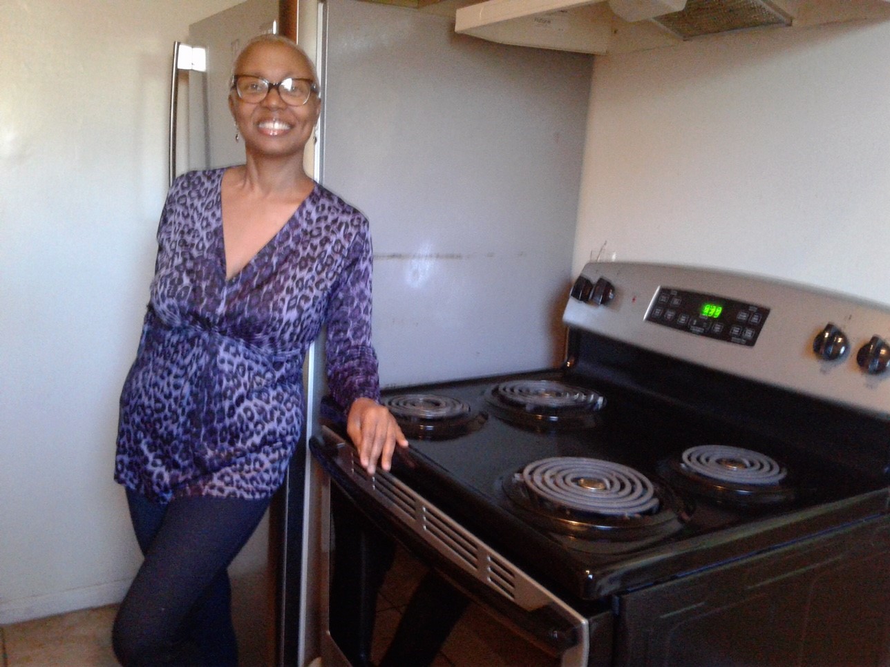 nichelle with stove.jpg